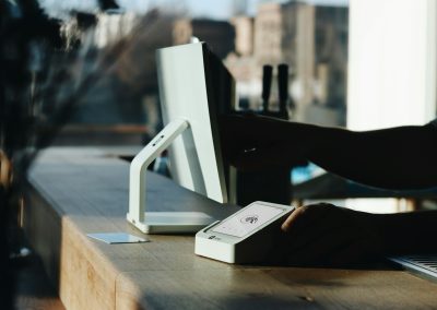 A person sitting at a desk using a computer