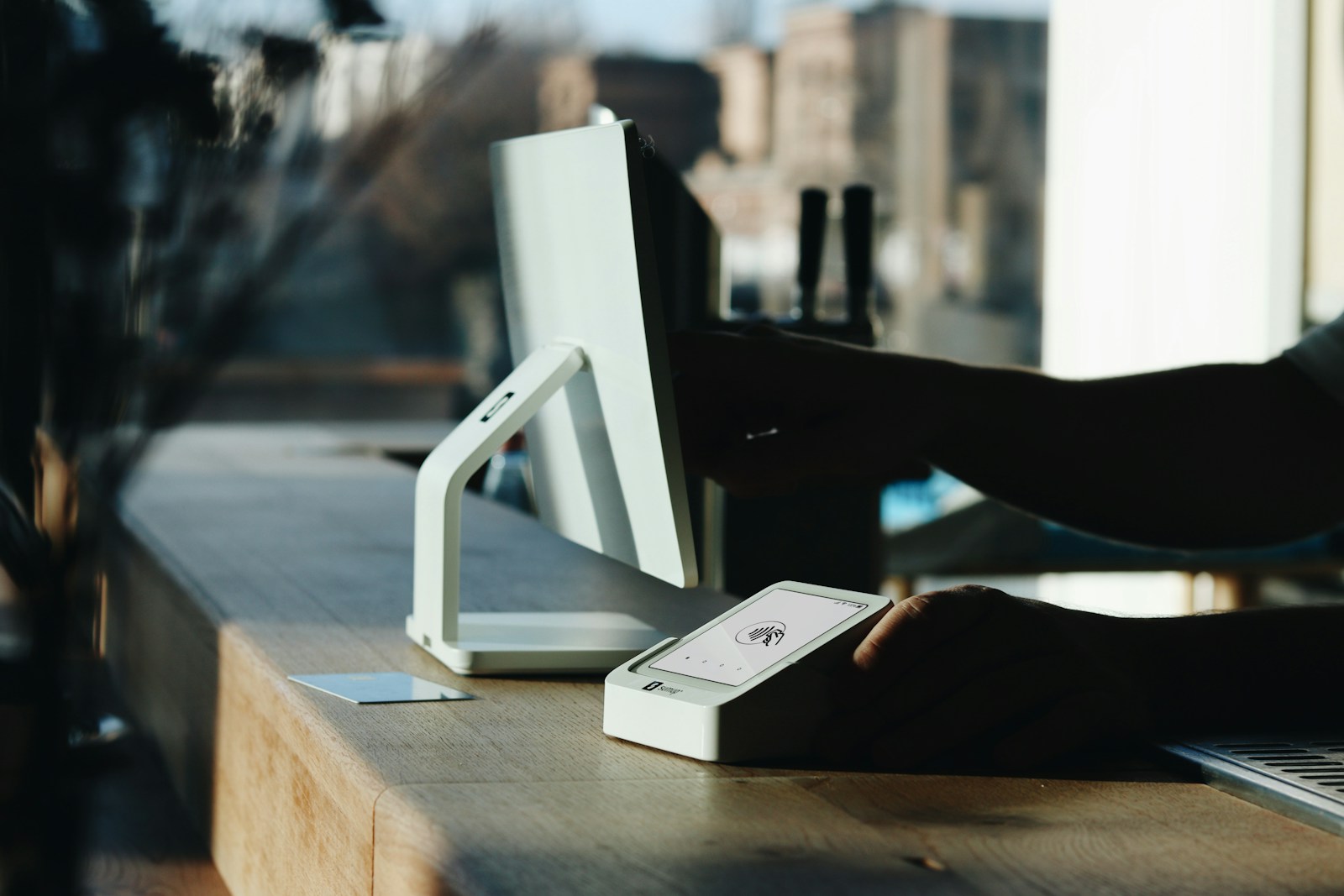 A person sitting at a desk using a computer